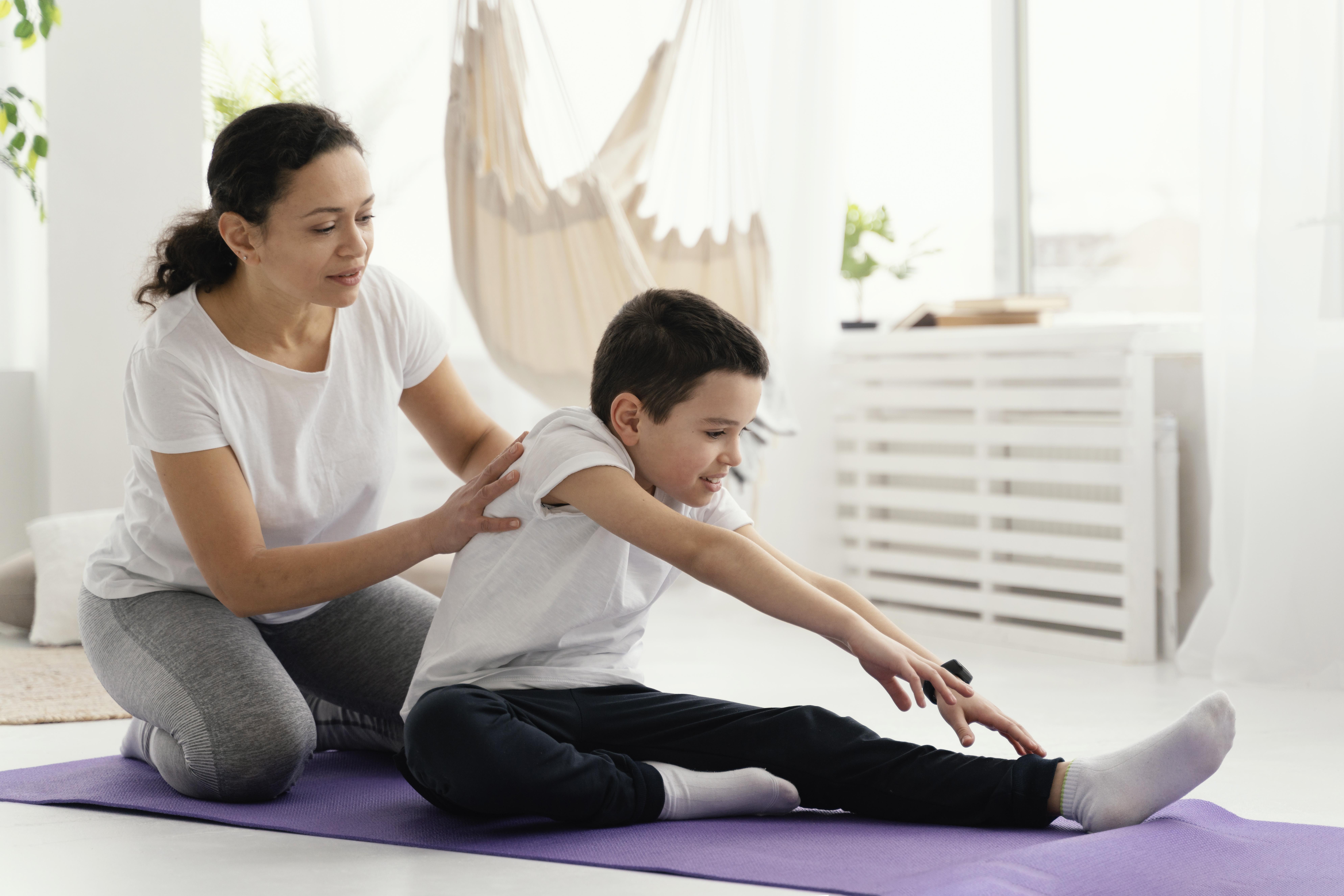 full-shot-woman-boy-yoga-mat
